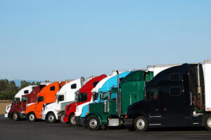 Trucks of different colors parked in a line
