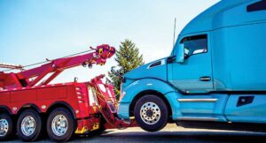 Tow truck hauling big rig