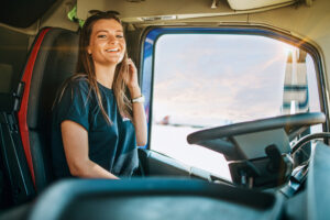 Professional female truck driver resting after drive