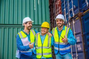 Teamwork Engineer concept, export management team is inspecting the containers. to manage the export of goods to foreign countries.