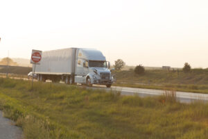 Truck Parked on the Side of the Road at Sunset in a Peaceful Countryside Setting