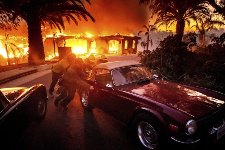 Strong winds push wildfire through Southern California community, burning dozens of homes