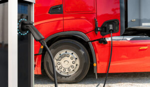 Electric truck batteries are charged from the charging station. Concept	.