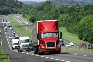 Red Eighteen Wheeler Truck Climbing Interstate in Tennessee