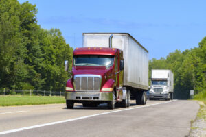 Eighteen Wheeler Trucks On Tennessee Interstate Highway In Summer