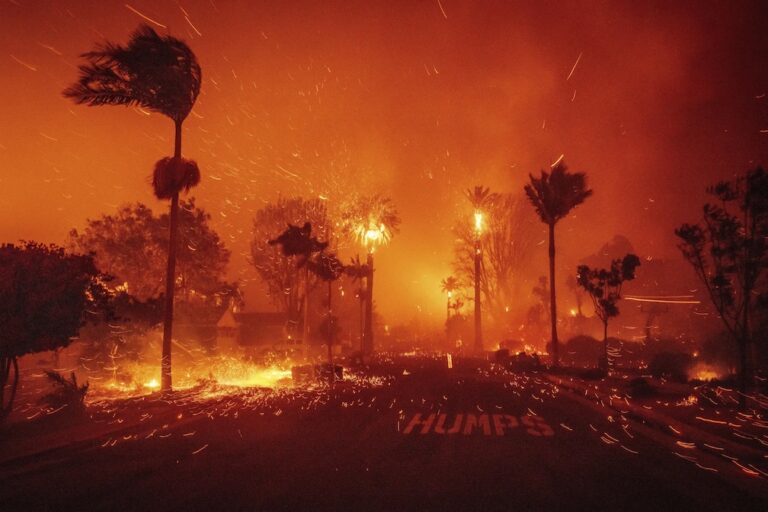 Thousands flee as wildfires burn out of control and destroy homes across the Los Angeles area