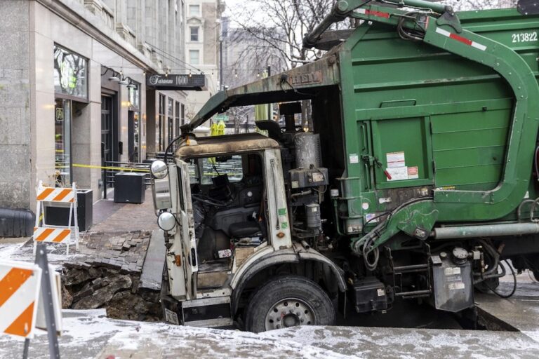 Downtown Omaha loses power for hours after a garbage truck gets stuck in a sinkhole