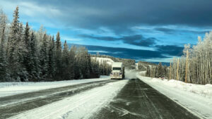 Semi truck traveling through the interior of Alaska