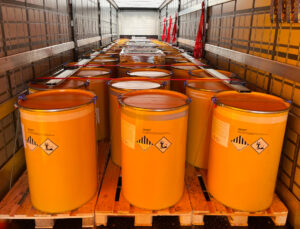 Loading, transportation and unloading of barrels with hazard class 9 in a semi trailer. Transportation of dangerous goods by ADR cargo transport