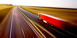 Truck on asphalt road motion blur