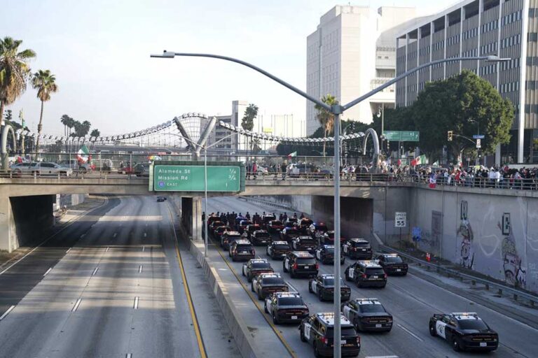 Marchers protesting planned deportations block LA’s 101 Freeway