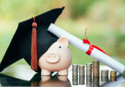 piggy bank With Graduation Cap on black glass floor,Money saving concept.