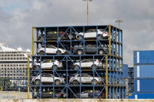 New cars in open container frames for shipping