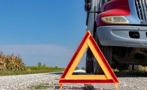 Truck with Caution Sign iStock 2165453061 web