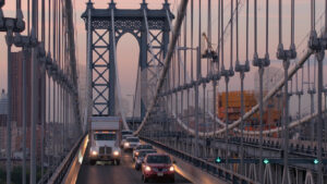 Traffic jam on busy expressway on Manhattan Bridge at twilight